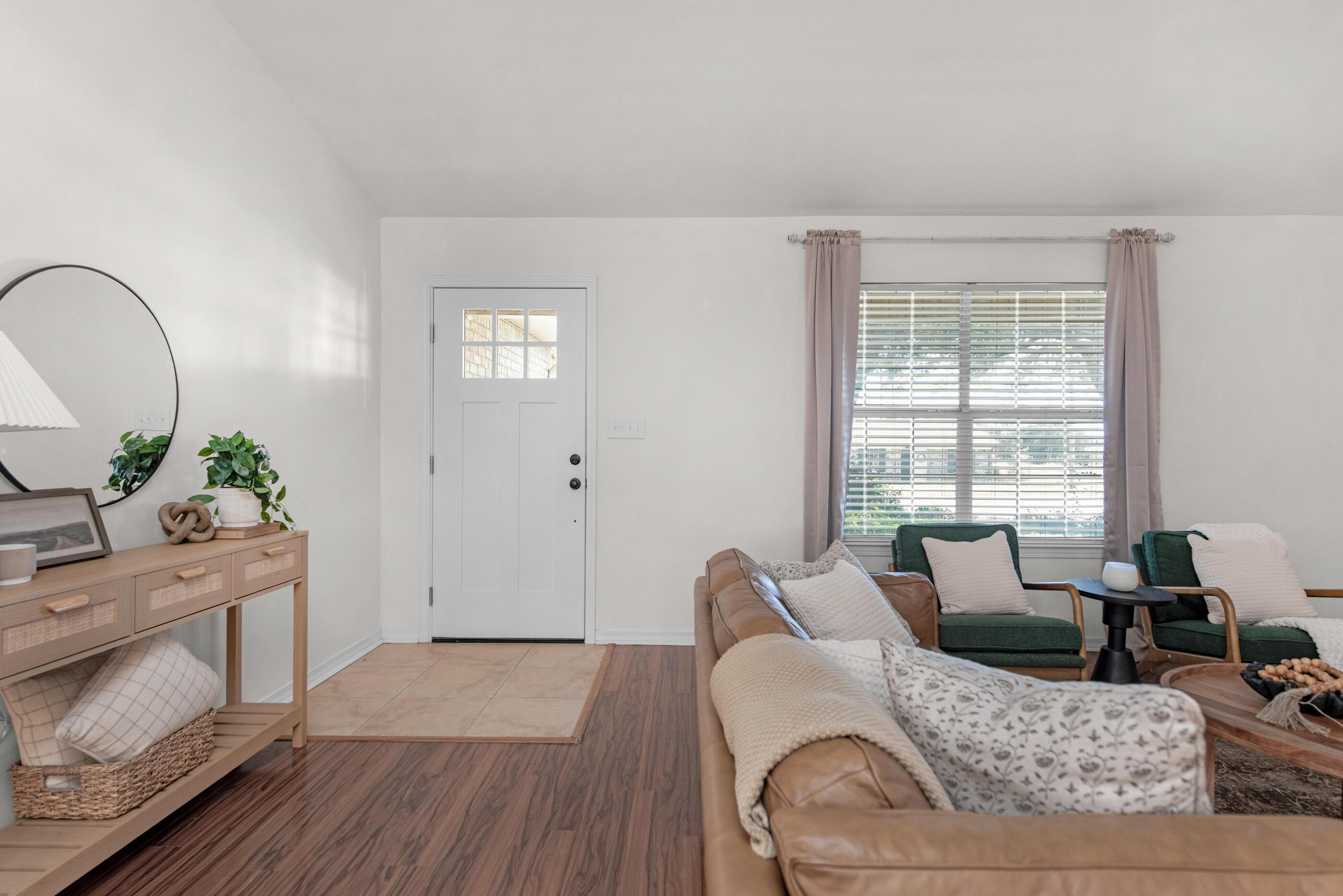 2709 Augustus Road Navarre, FL 32566 - Photo 6 of 46 a living room with furniture and wooden floor
