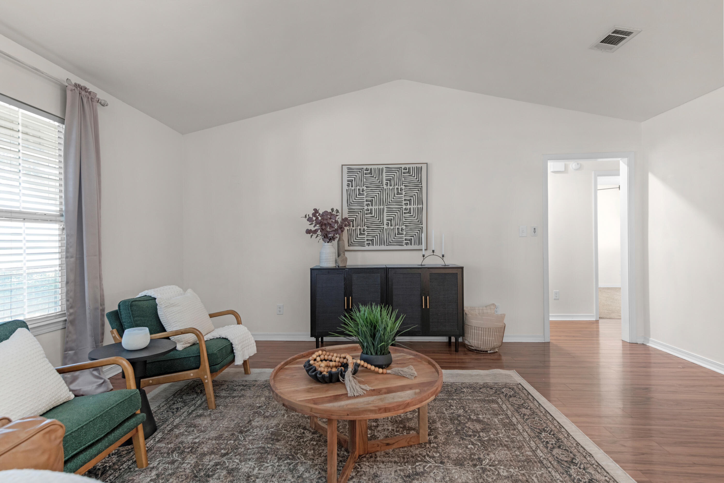 2709 Augustus Road Navarre, FL 32566 - Photo 7 of 46 a living room with furniture potted plant and a fireplace