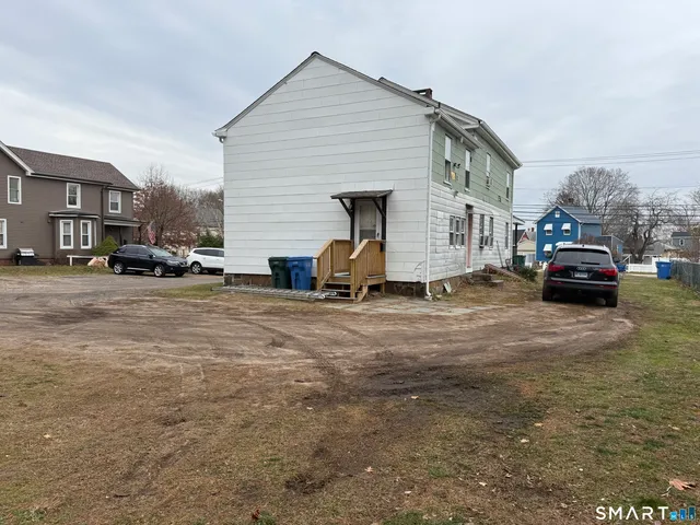 a view of hallway with wooden floor