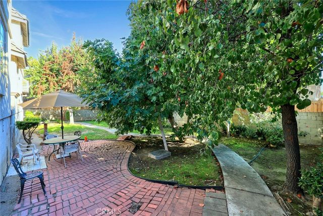 a view of a backyard with sitting area