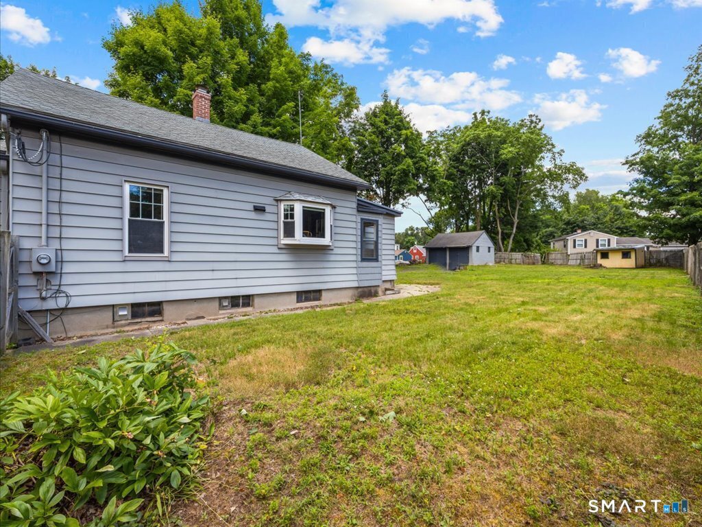 60 Pond Hill Road Wallingford, CT 06492 - Photo 27 of 36 SIDE OF HOUSE/ VIEW OF YARD