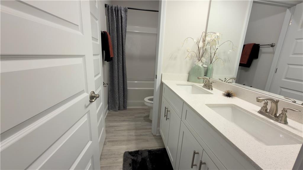 620 Bald Ridge Circle Demorest, GA 30535 - Photo 37 of 43 a bathroom with a double vanity sink and mirror