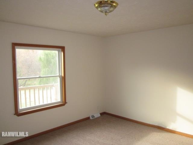 7264 East German Valley Road German Valley, IL 61039 - Photo 15 of 25 an empty room with a window
