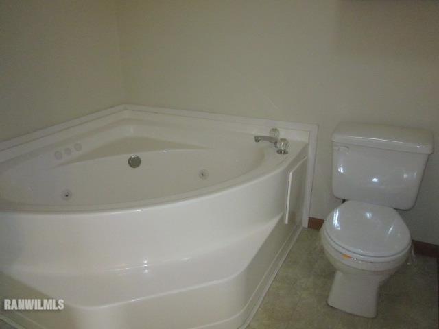 7264 East German Valley Road German Valley, IL 61039 - Photo 16 of 25 a spacious bathroom with a bathtub and toilet