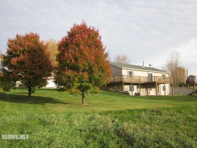 7264 East German Valley Road German Valley, IL 61039 - Photo 21 of 25 a view of a house with a big yard and large trees