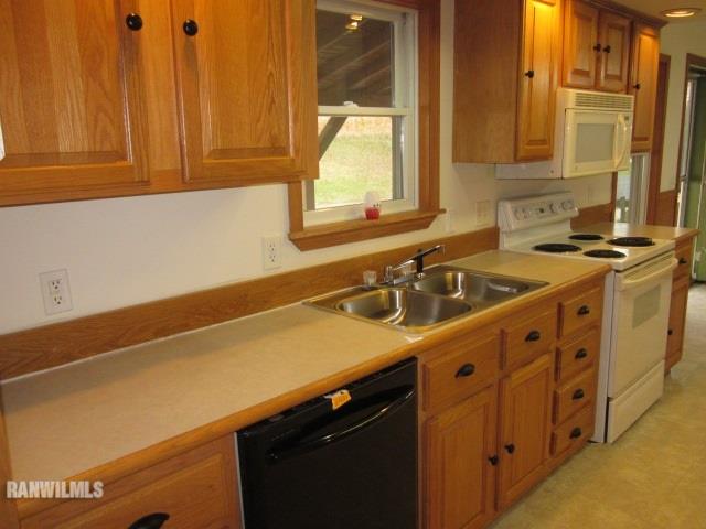 7264 East German Valley Road German Valley, IL 61039 - Photo 6 of 25 a kitchen with a sink cabinets and a window