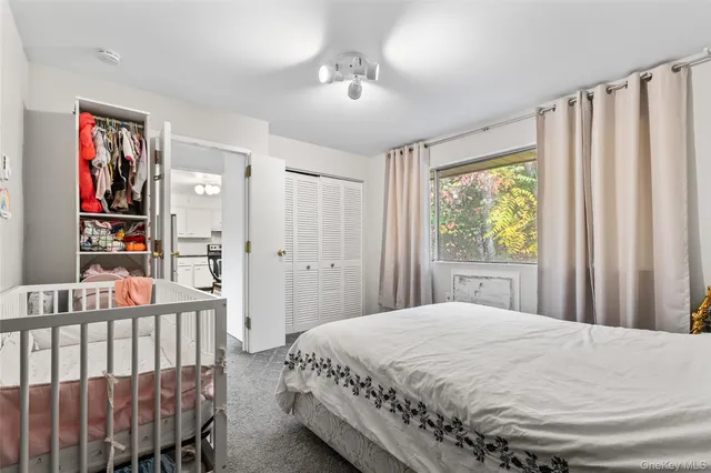 a bathroom with a toilet a sink and a shower curtain
