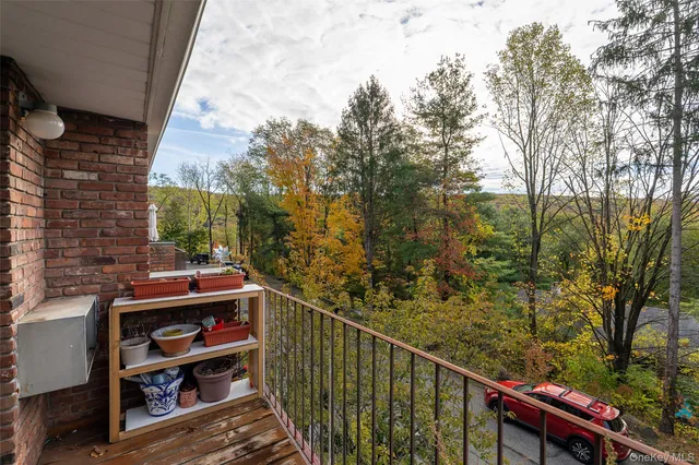 a kitchen with stainless steel appliances a table and chairs in it