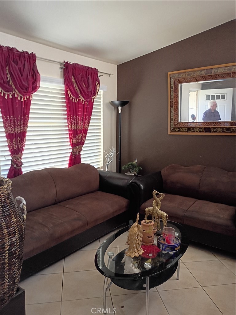 14724 Cypress Road Adelanto, CA 92301 - Photo 2 of 8 a living room with furniture and a window