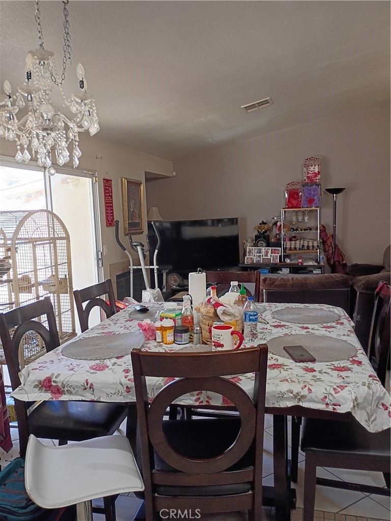 14724 Cypress Road Adelanto, CA 92301 - Photo 4 of 8 a view of a dining room with furniture