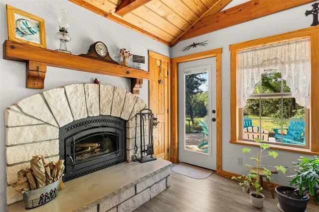 a view of livingroom with furniture and a fireplace