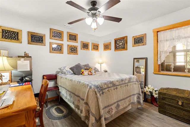 a bedroom that has a bed and a chandelier