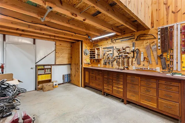 a bed room with a bed and a dresser