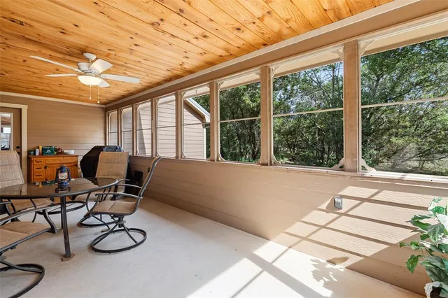 a work room with furniture and a window