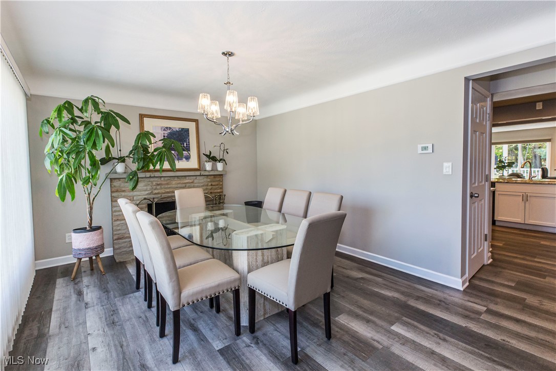 2430 Rockside Road Independence, OH 44131 - Photo 4 of 46 Dining area with dark wood-style flooring and a chandelier