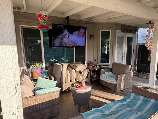 a outdoor living space with furniture and a potted plant