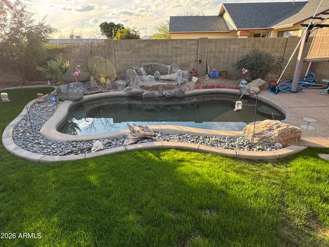 a view of a swimming pool with a garden