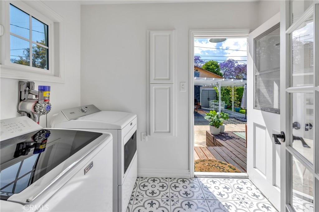 3743 North Studebaker Road Long Beach, CA 90808 - Photo 12 of 34 Its a great place to do laundry while looking out over the pretty backyard.