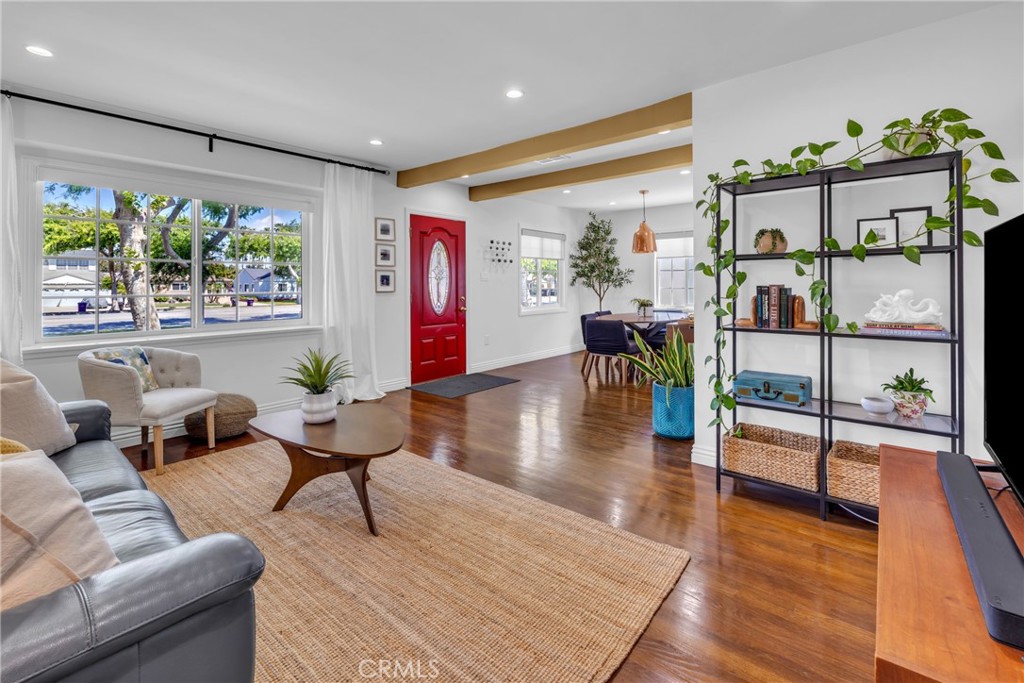 3743 North Studebaker Road Long Beach, CA 90808 - Photo 3 of 34 The living room is bathed in natural light.