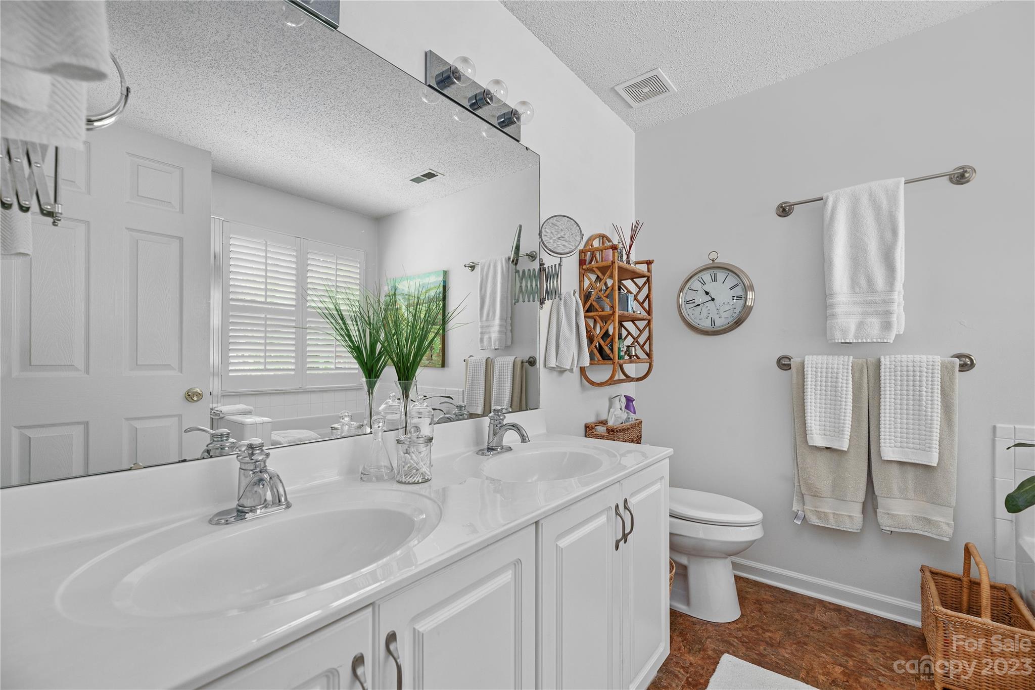 13328 Sloe Way Huntersville, NC 28078 - Photo 14 of 32 a bathroom with a toilet sink and mirror