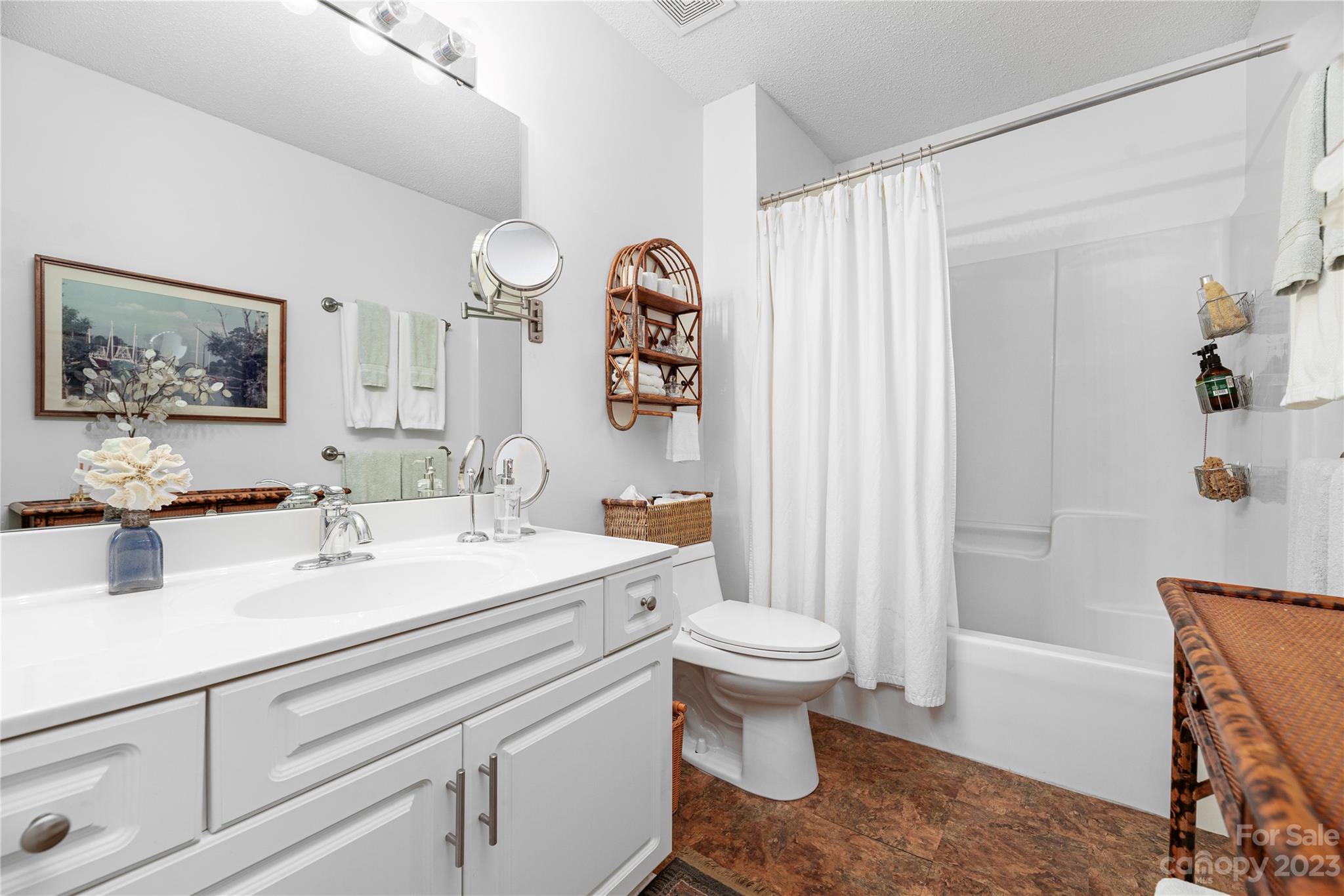 13328 Sloe Way Huntersville, NC 28078 - Photo 17 of 32 a spacious bathroom with a sink and a mirror