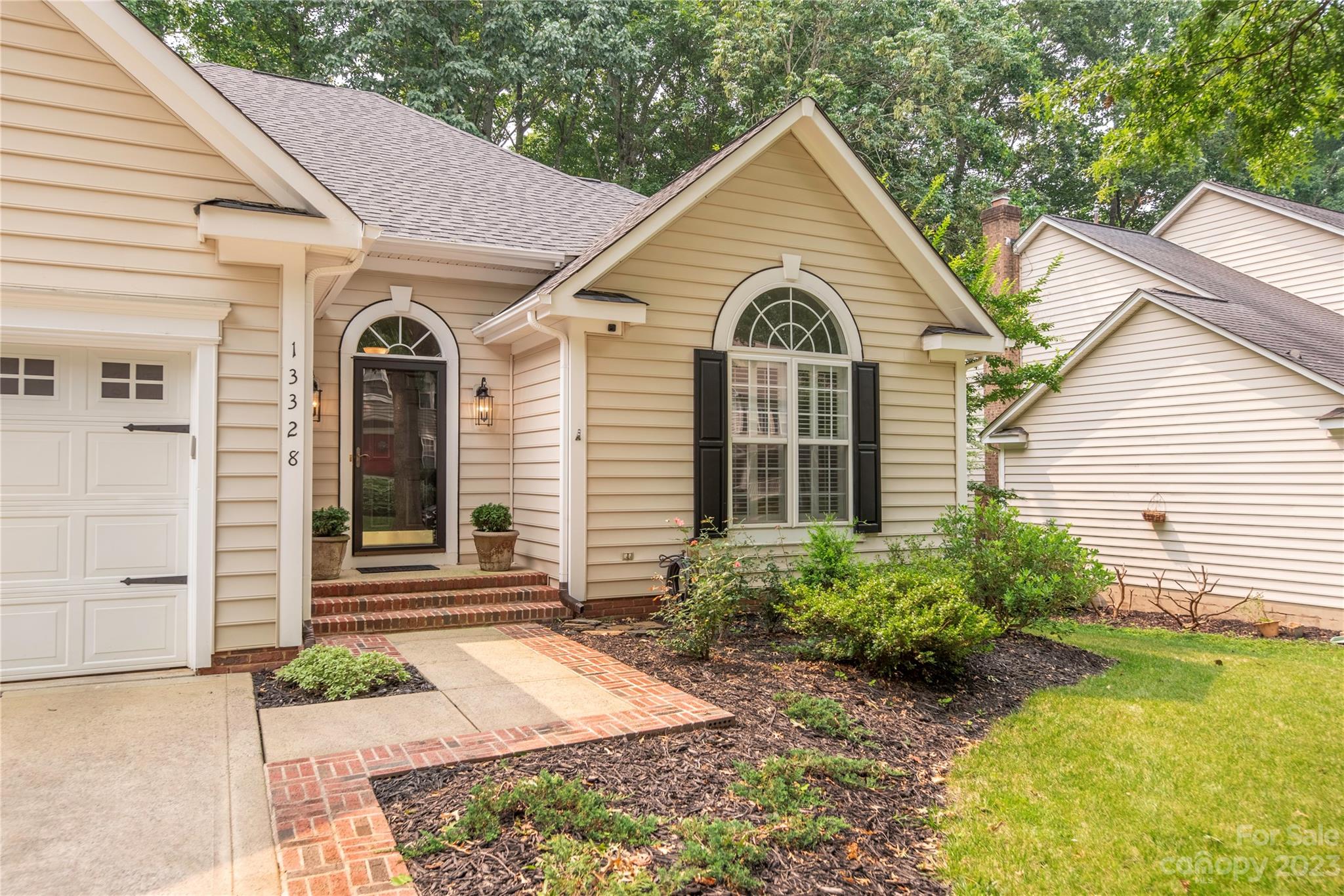 13328 Sloe Way Huntersville, NC 28078 - Photo 31 of 32 a front view of a house with garden