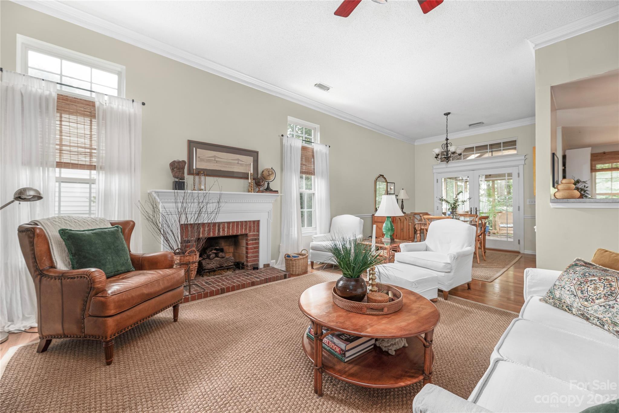 13328 Sloe Way Huntersville, NC 28078 - Photo 4 of 32 a living room with furniture and a fireplace