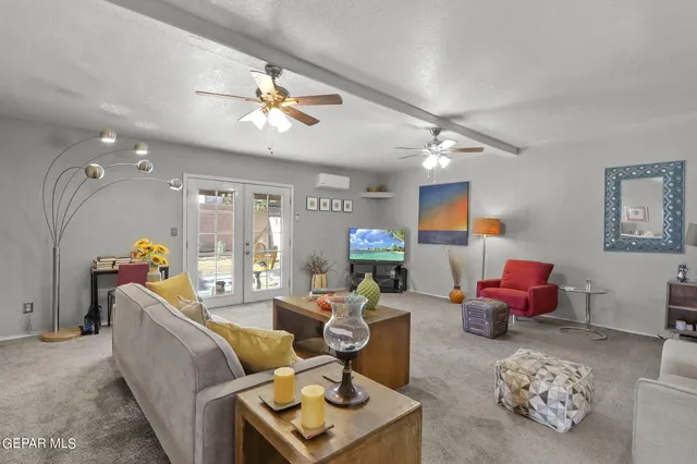 a workspace with wooden floor and a window