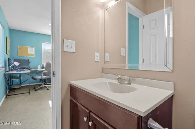 a bedroom with a bed and a chair