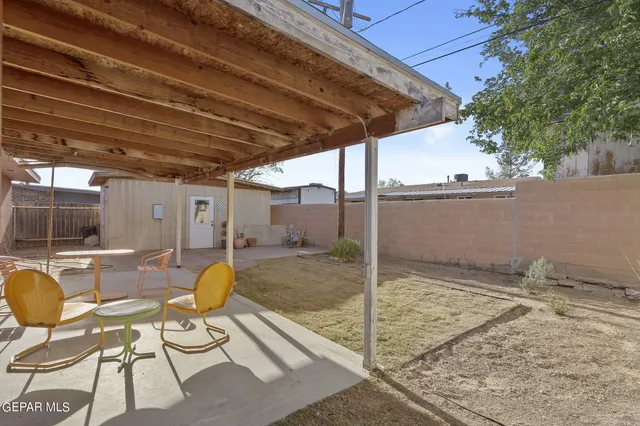 a view of a swimming pool with a patio