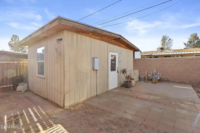 a view of a house with backyard and balcony