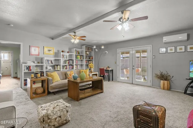 a living room with furniture and a large window