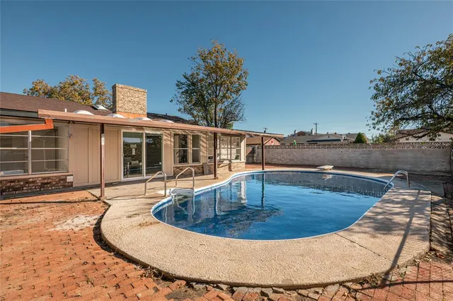 a view of a house with swimming pool