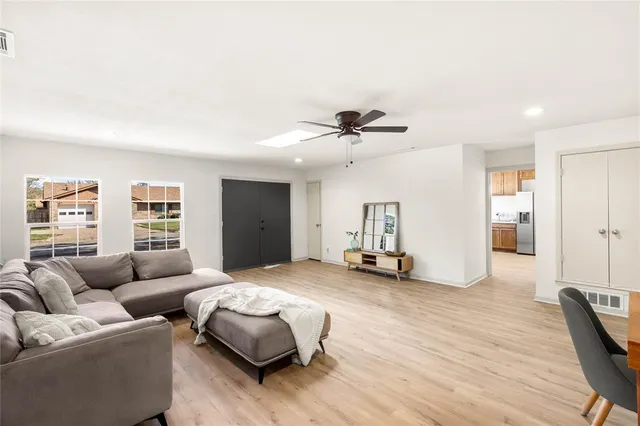 a bedroom with furniture and a wooden floor