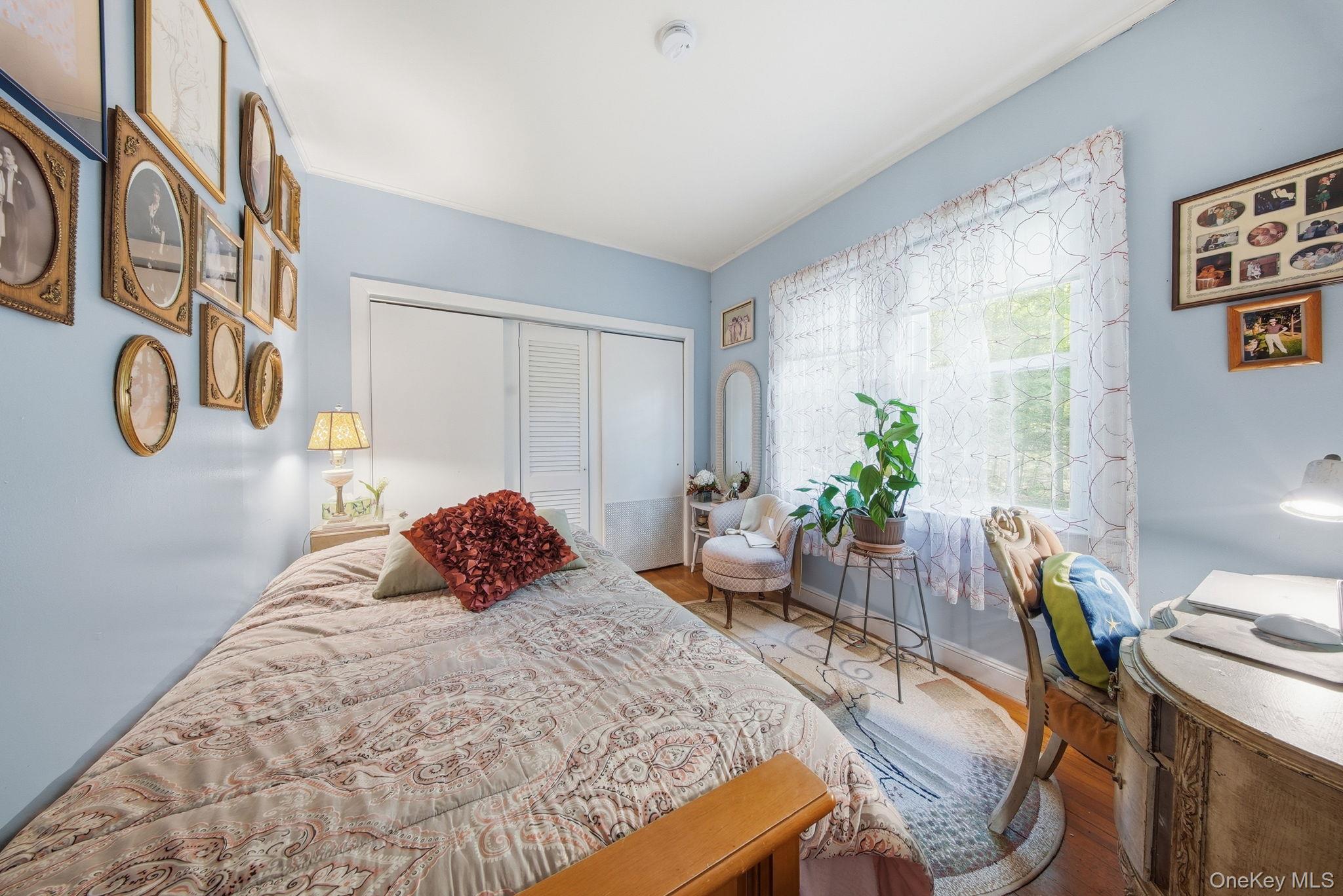 370 Starlight Road Monticello, NY 12701 - Photo 29 of 49 a bedroom with a bed table chair and a window