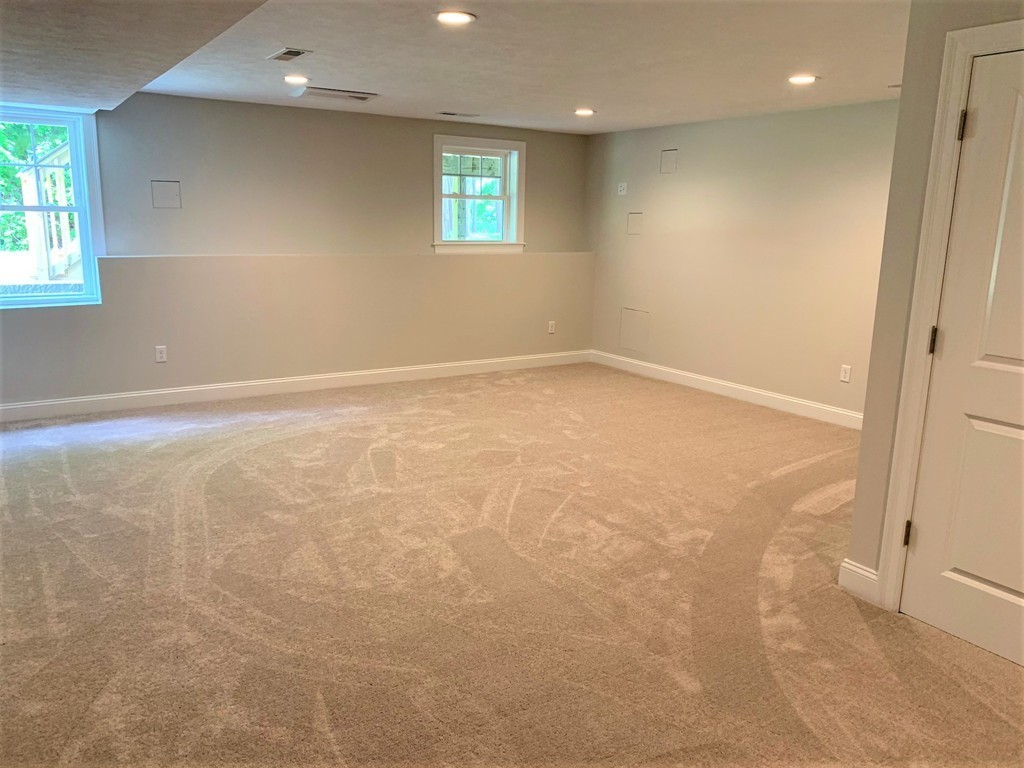 25 Shaker Road, Unit B Ayer, MA 01432 - Photo 13 of 16 an empty room with a window