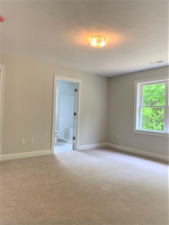 25 Shaker Road, Unit B Ayer, MA 01432 - Photo 8 of 16 a view of an empty room with a window