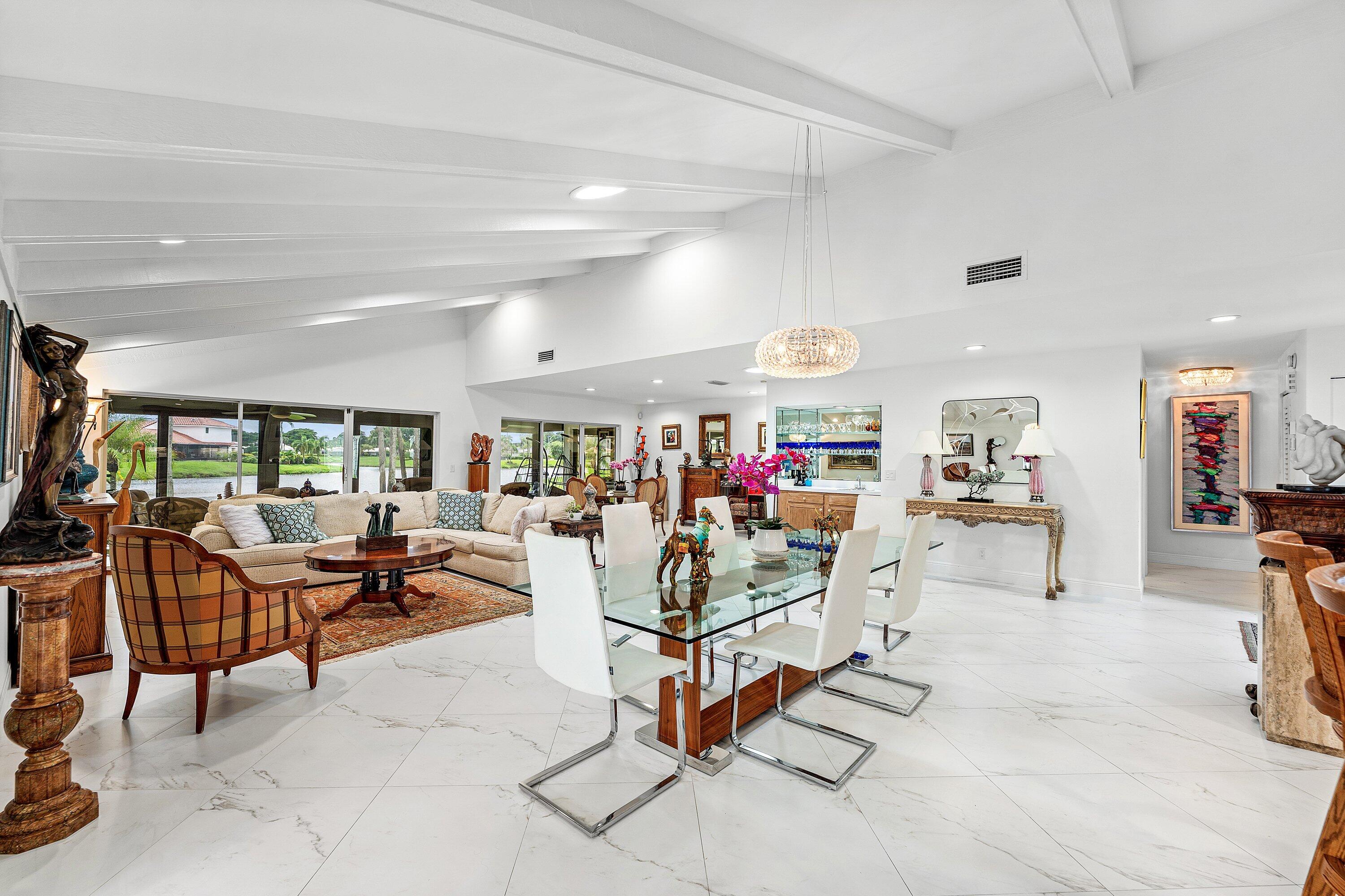 35 Woods Lane Boynton Beach, FL 33436 - Photo 16 of 82 a view of a dining room with lots of tables and white walls