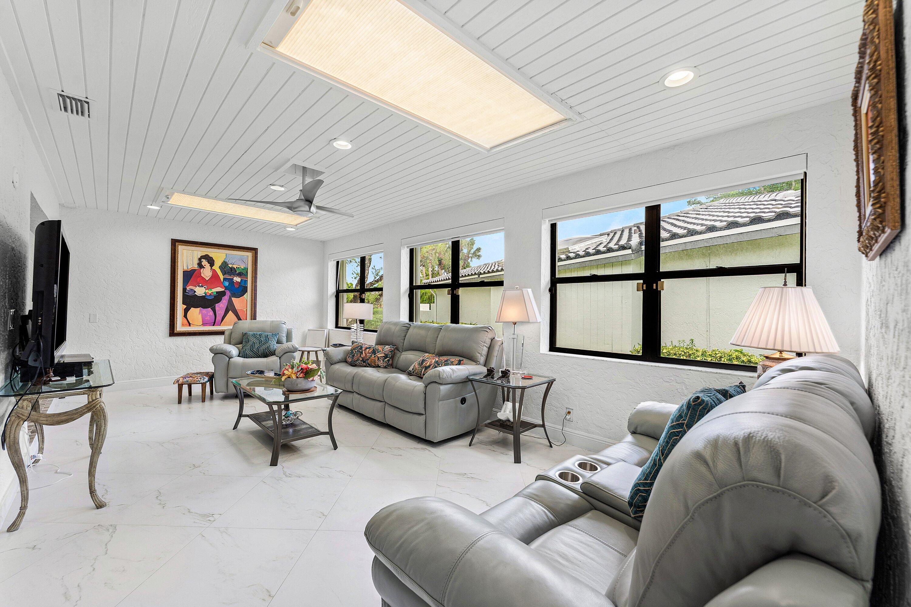 35 Woods Lane Boynton Beach, FL 33436 - Photo 18 of 82 a living room with furniture and a flat screen tv
