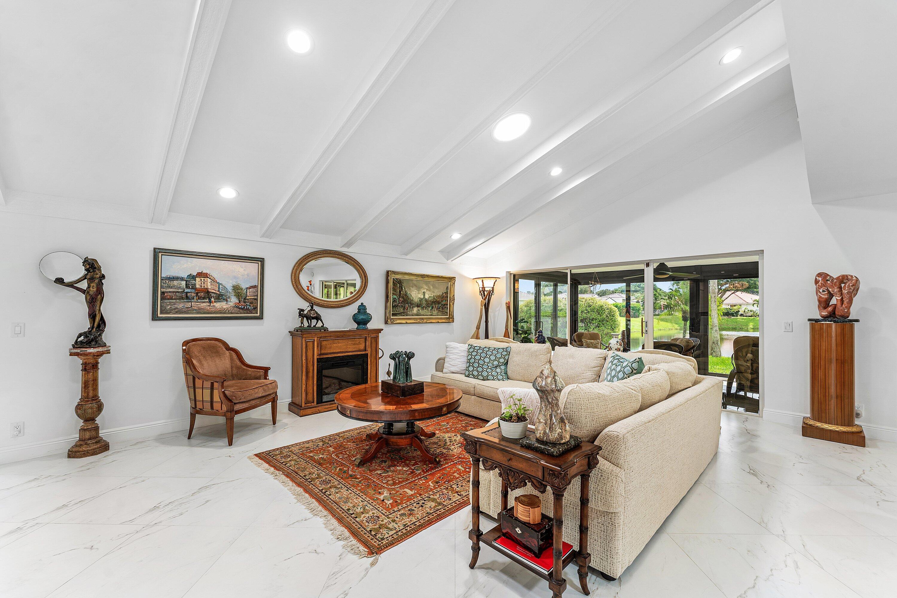 35 Woods Lane Boynton Beach, FL 33436 - Photo 23 of 82 a living room with furniture a rug and a large window