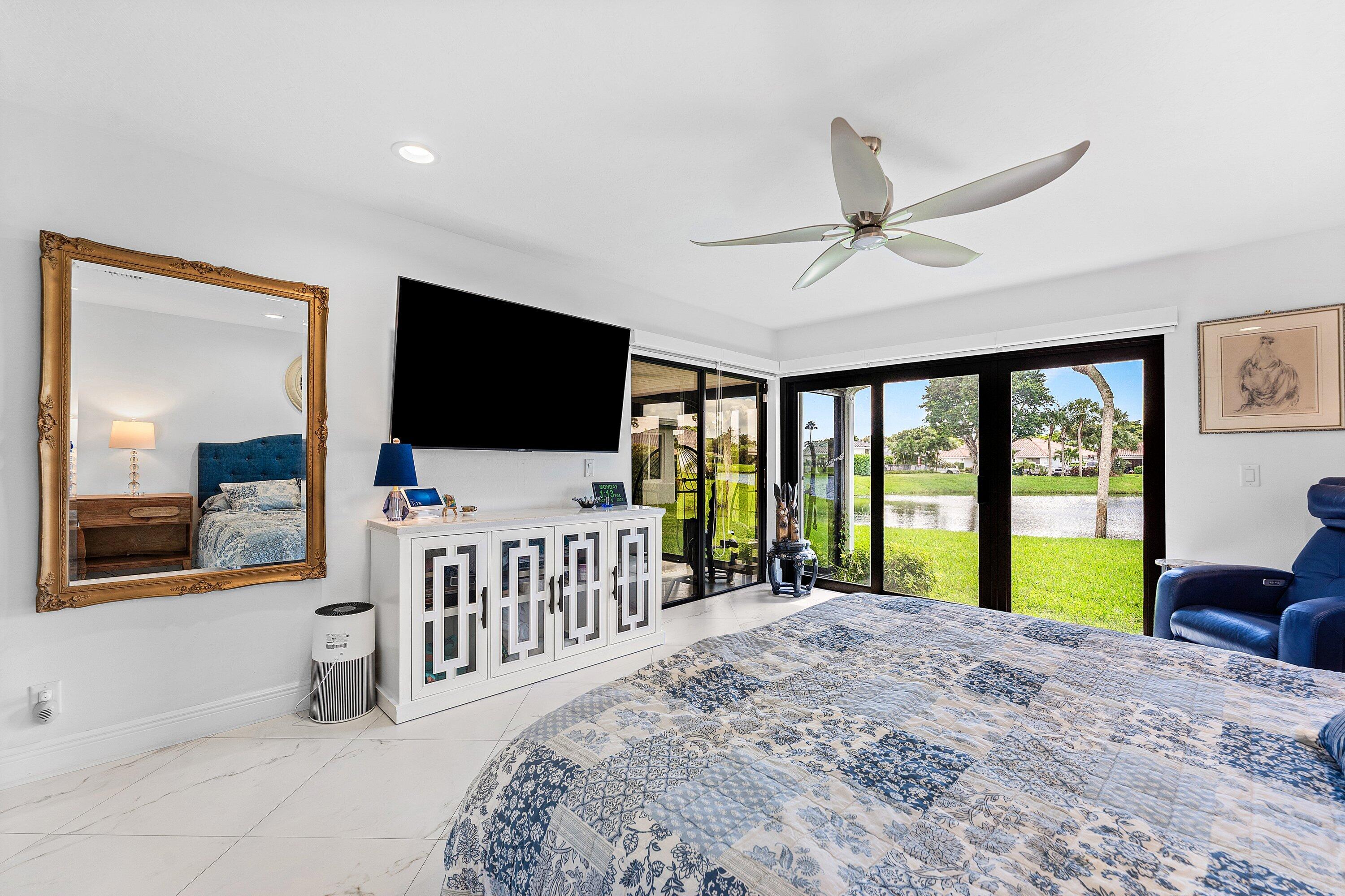 35 Woods Lane Boynton Beach, FL 33436 - Photo 26 of 82 a bedroom with furniture and flat screen tv
