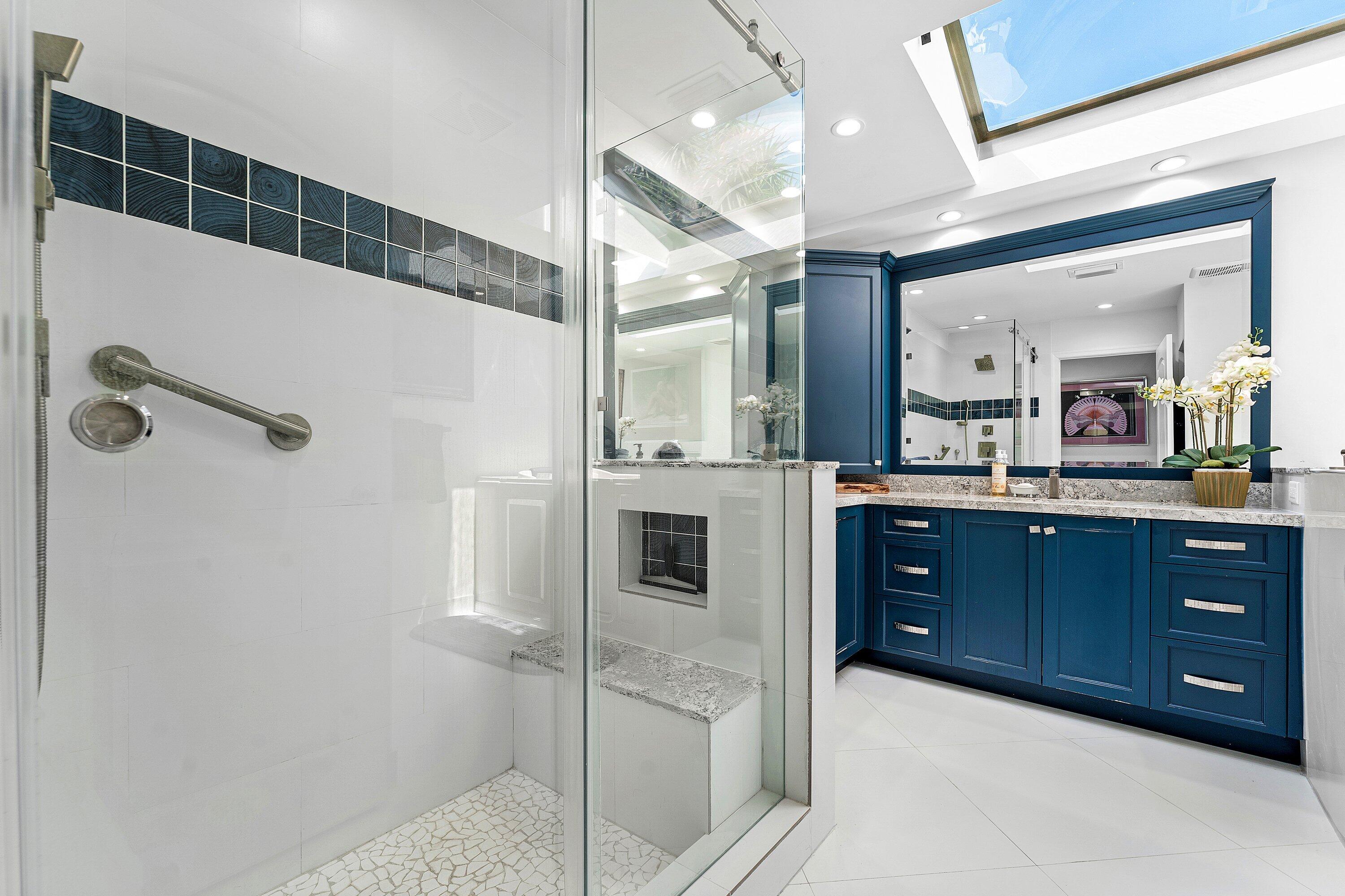 35 Woods Lane Boynton Beach, FL 33436 - Photo 29 of 82 a bathroom with a sink a large mirror and shower