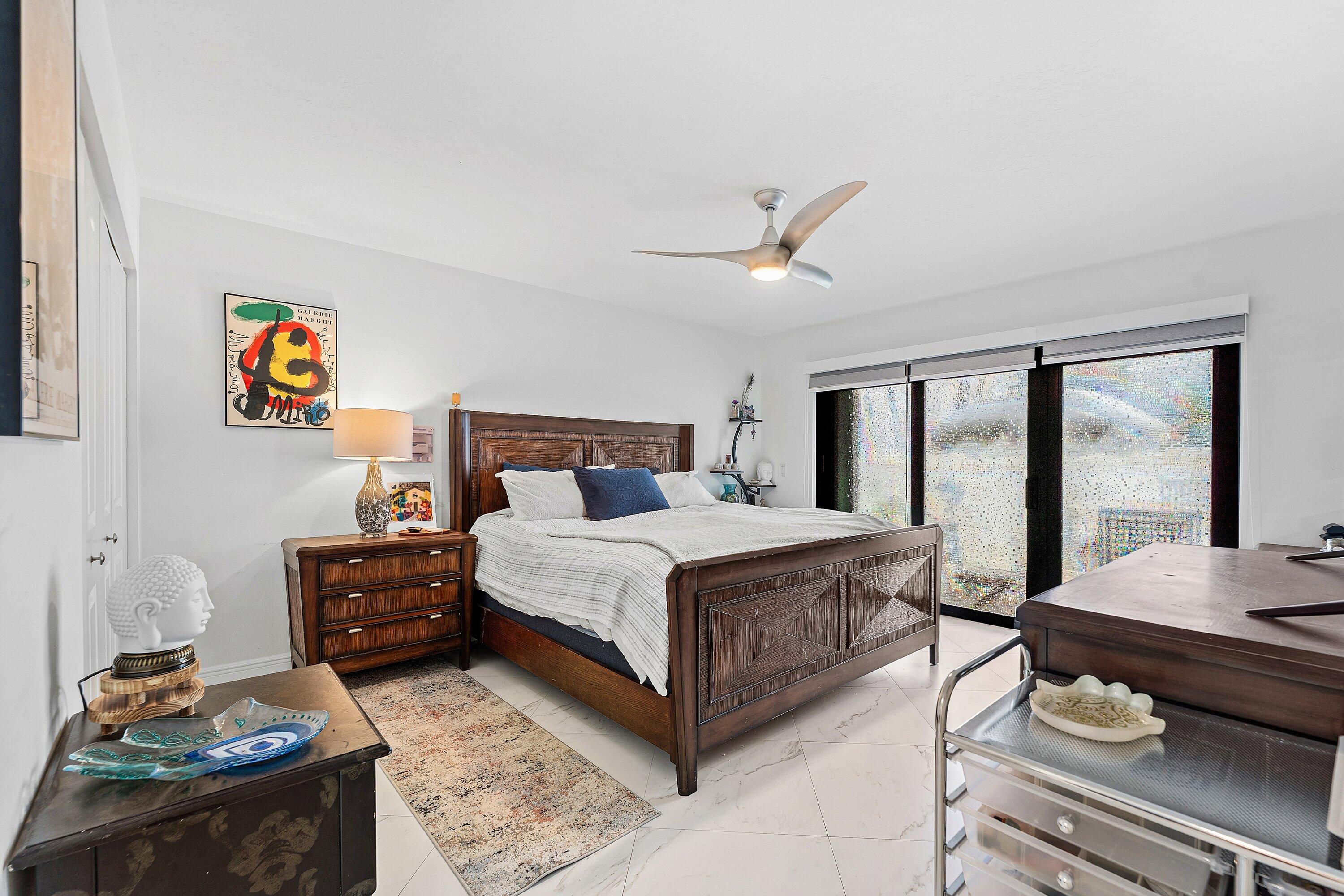 35 Woods Lane Boynton Beach, FL 33436 - Photo 31 of 82 a bedroom with a bed and wooden floor