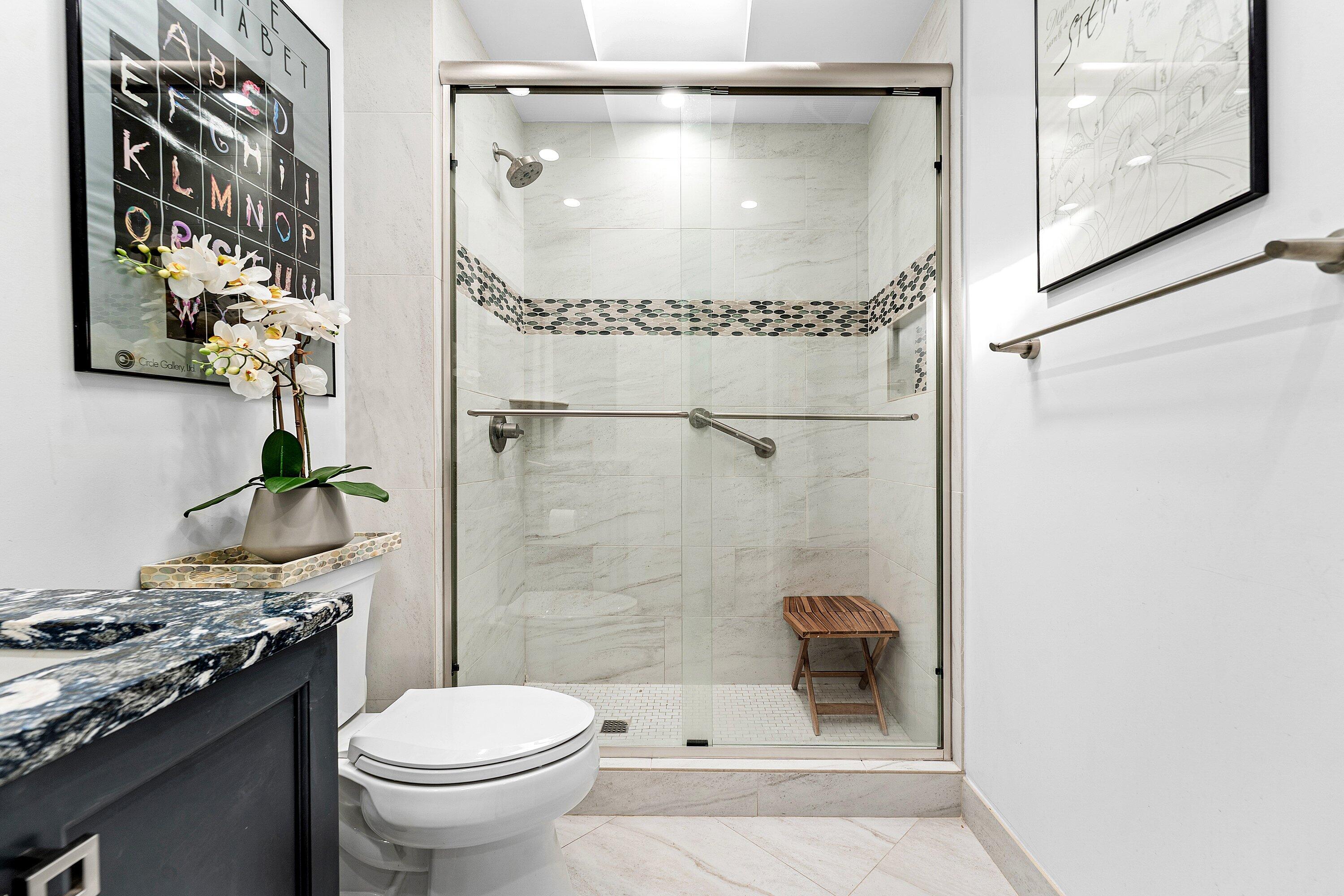 35 Woods Lane Boynton Beach, FL 33436 - Photo 33 of 82 a bathroom with a granite countertop sink toilet and shower
