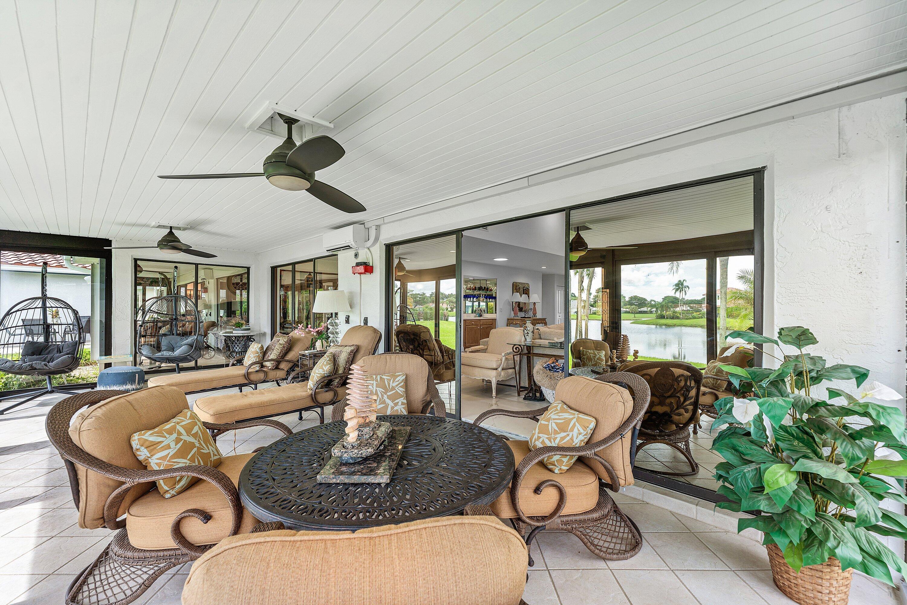 35 Woods Lane Boynton Beach, FL 33436 - Photo 38 of 82 a living room with patio furniture and a large window