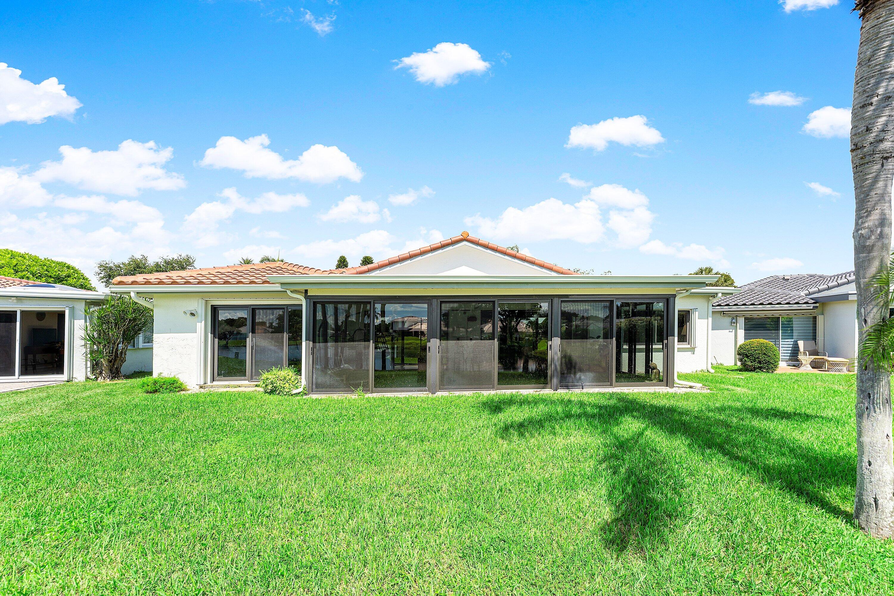 35 Woods Lane Boynton Beach, FL 33436 - Photo 41 of 82 a view of a house with a yard and sitting area