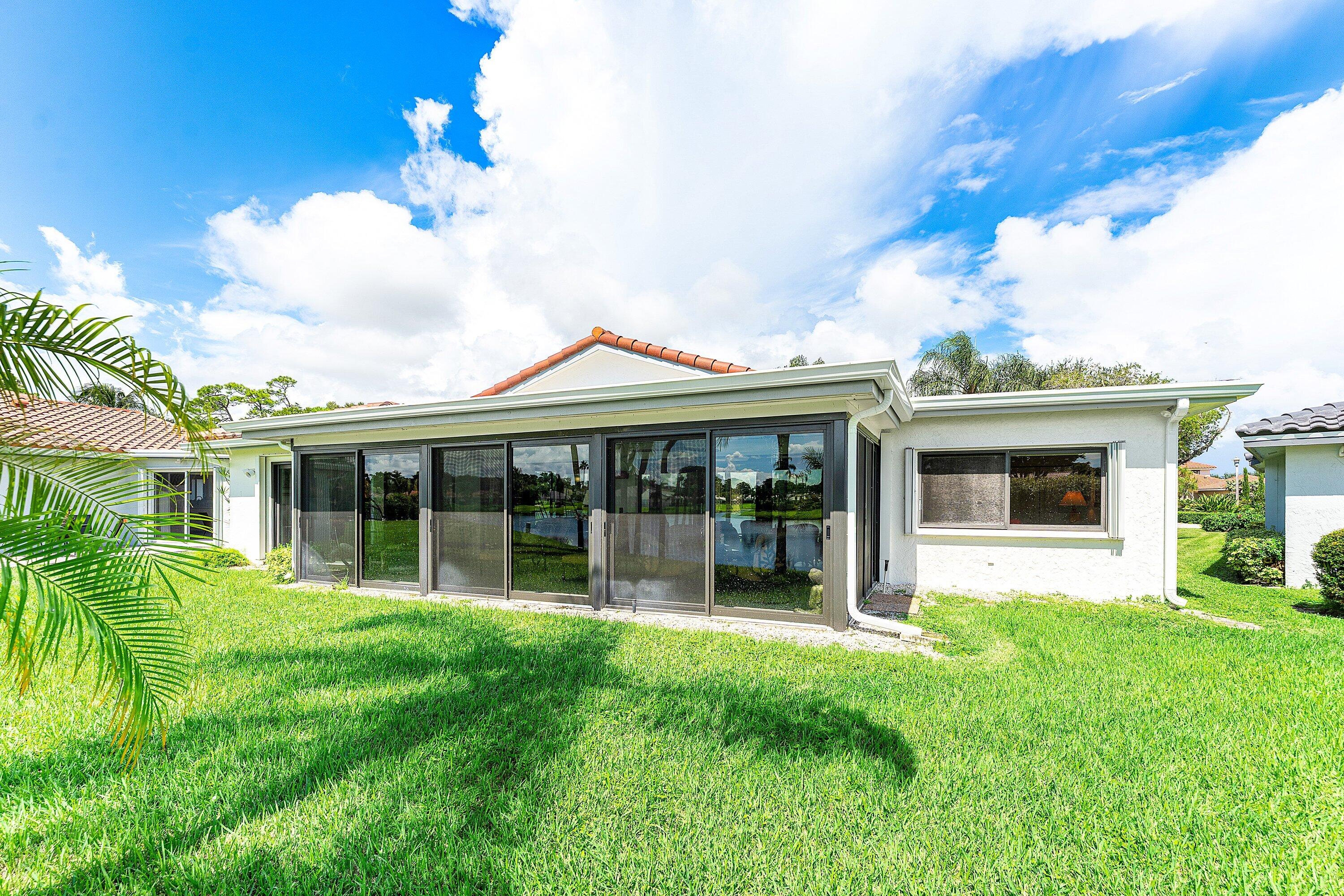 35 Woods Lane Boynton Beach, FL 33436 - Photo 42 of 82 a view of a house with a yard