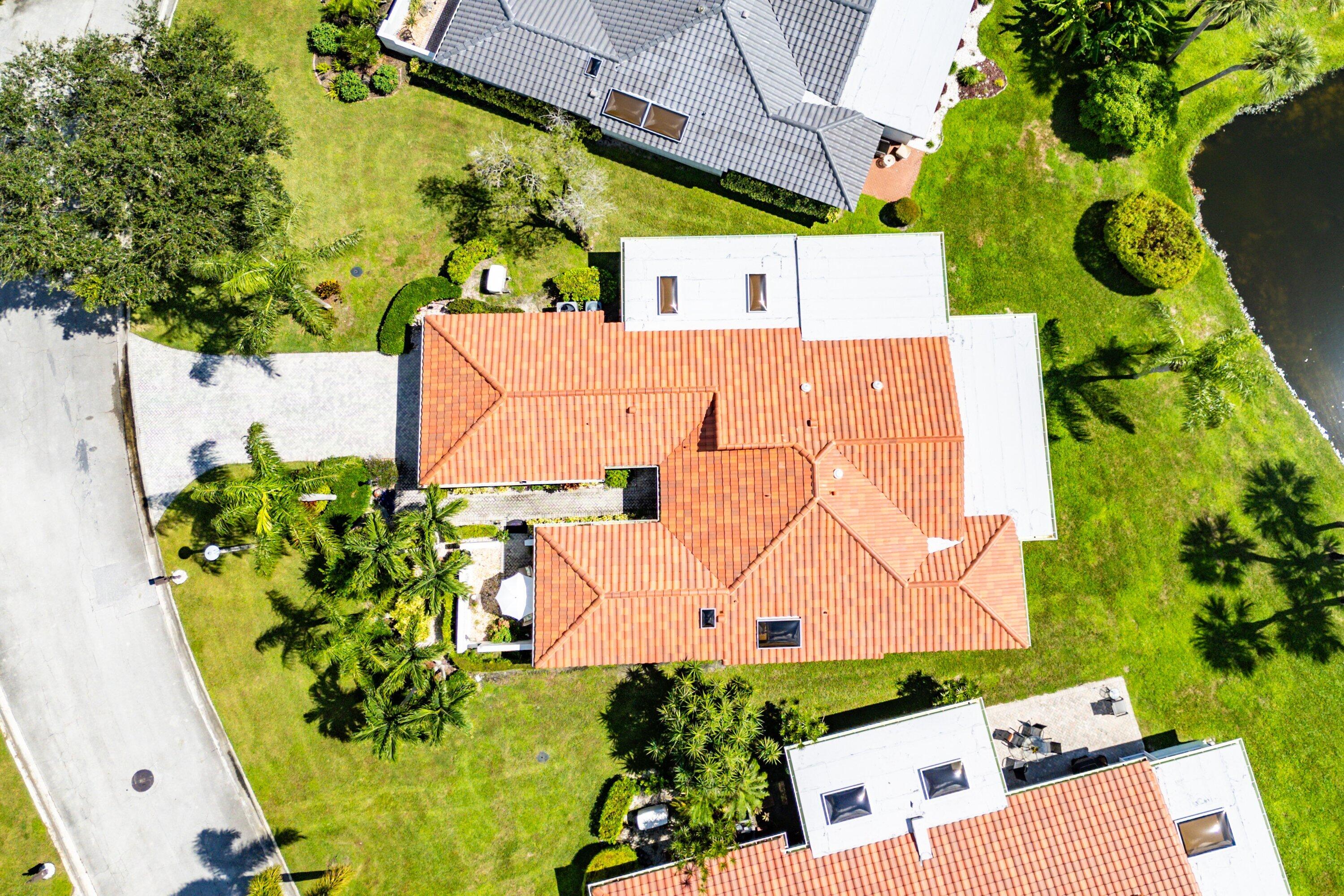 35 Woods Lane Boynton Beach, FL 33436 - Photo 51 of 82 an aerial view of a house with a yard and a large pool