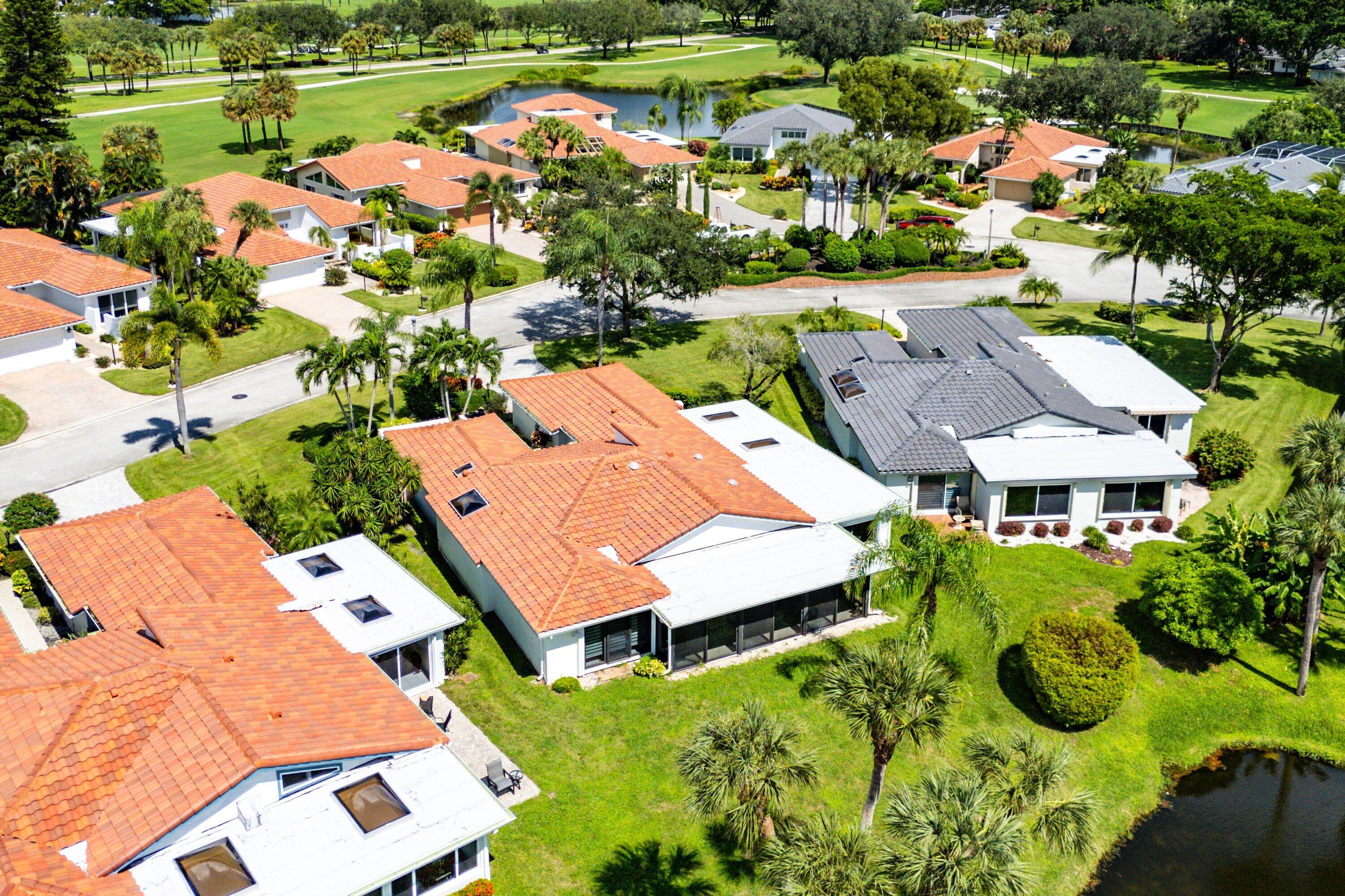 35 Woods Lane Boynton Beach, FL 33436 - Photo 52 of 82 an aerial view of multiple houses with yard