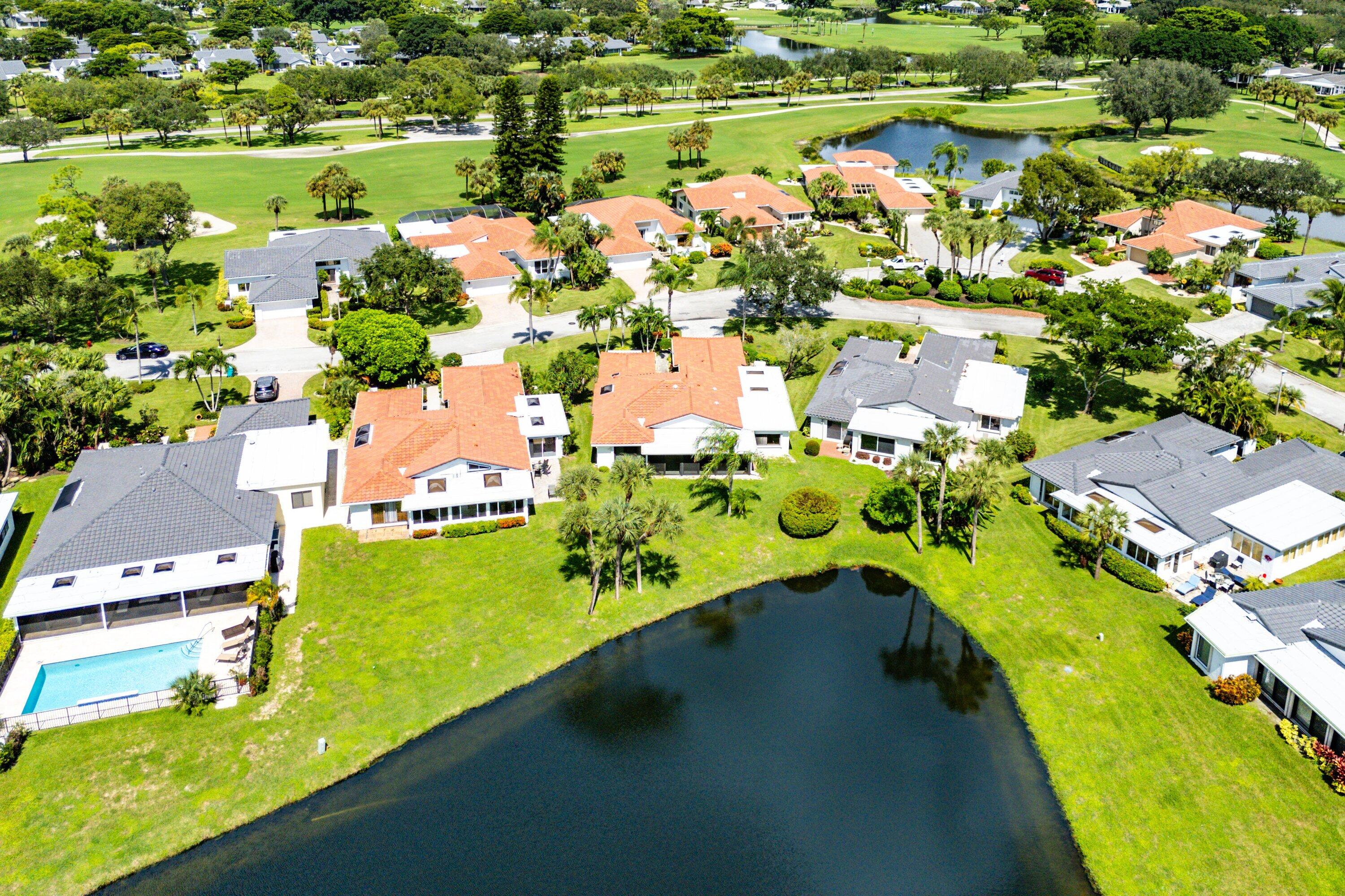 35 Woods Lane Boynton Beach, FL 33436 - Photo 54 of 82 an aerial view of a houses with a lake view